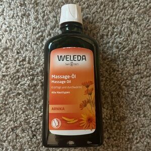 Weleda Arnika Massage Oil - Orange and Black